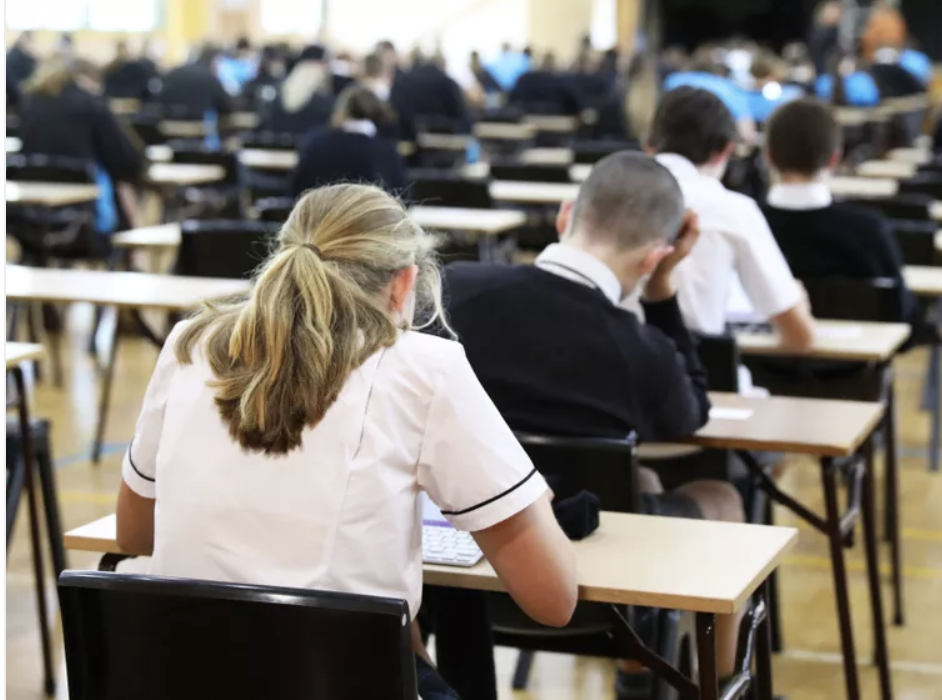 Students sitting at desks doing exams